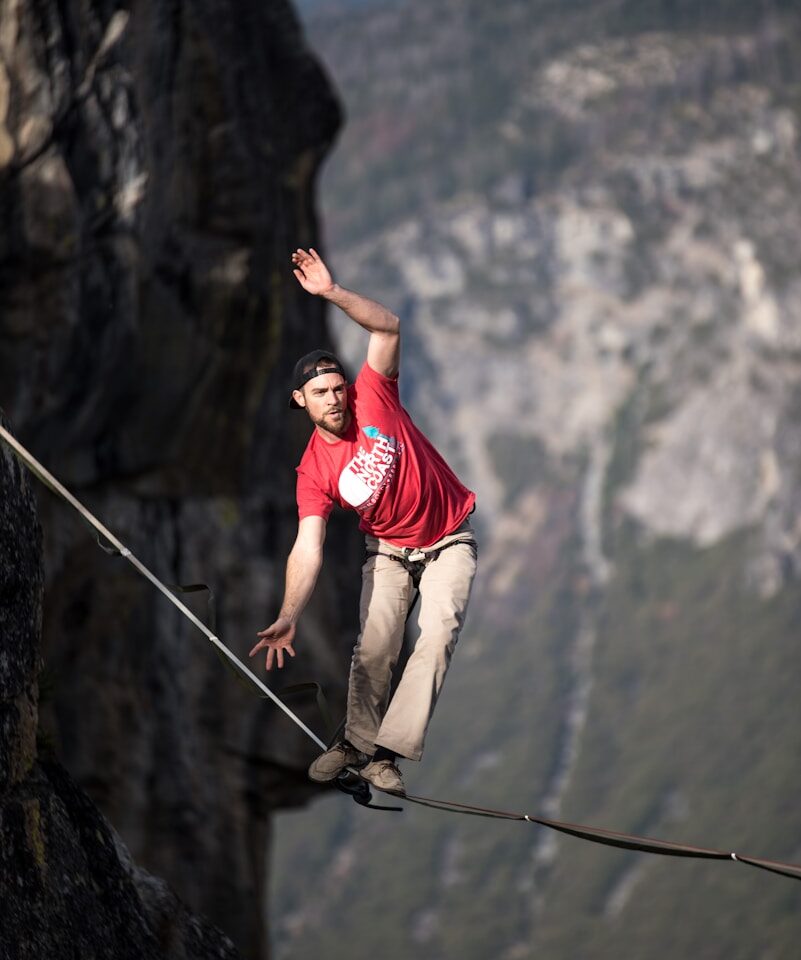 man waking on rope