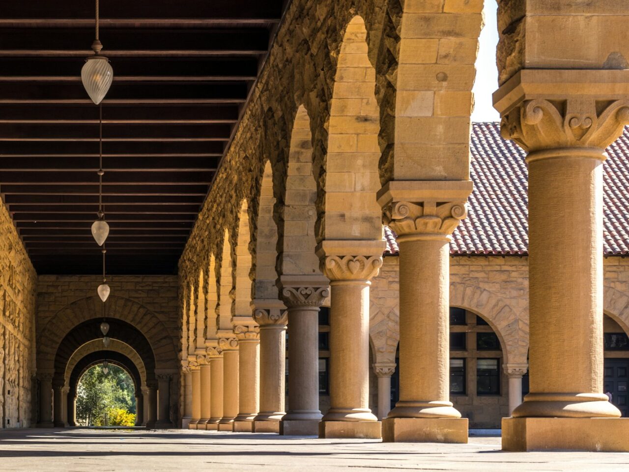 brown concrete hallways with columns
